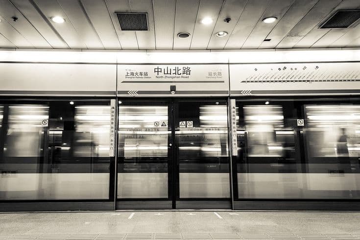 Shanghai Metro subway train at modern station with passengers