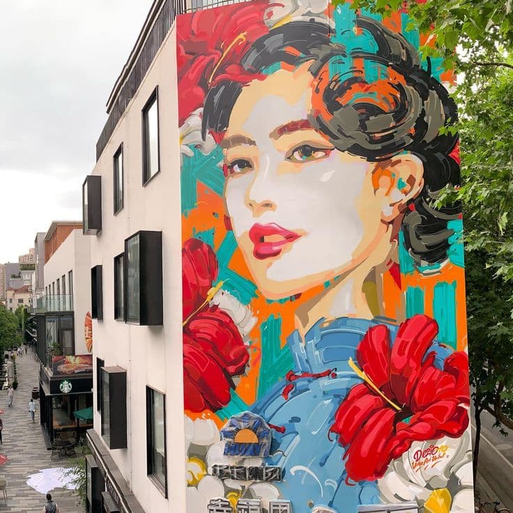 Colorful street art mural on a factory wall in Shanghai M50 Creative Park